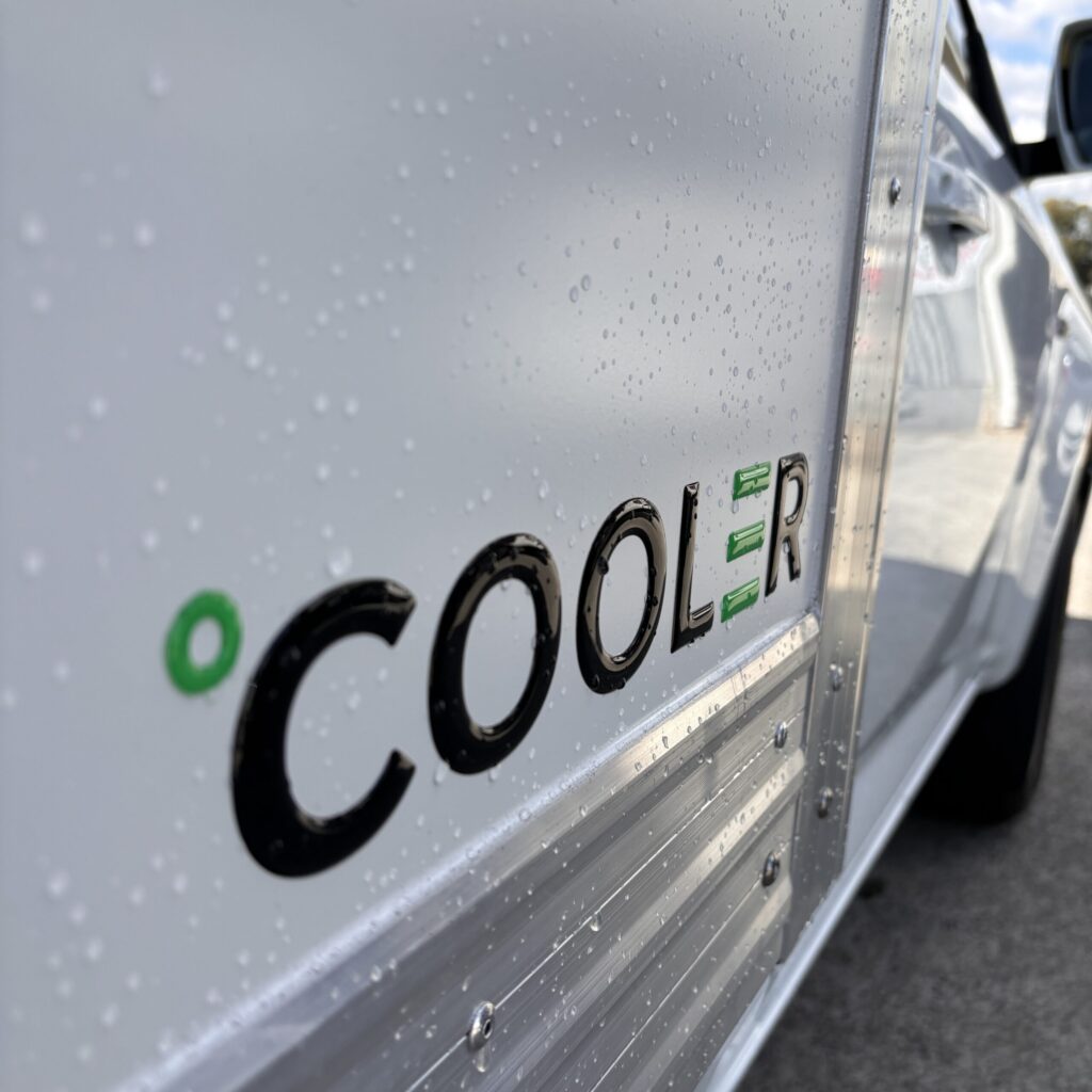 Company Logo on the side of custom refrigerated ute body with integrated ute refrigeration units, built for efficient temperature-controlled deliveries using refrigerated utes.