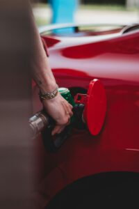 A person putting fuel in a car | Featured image for the Fleet Fuel Cost Optimisation page.